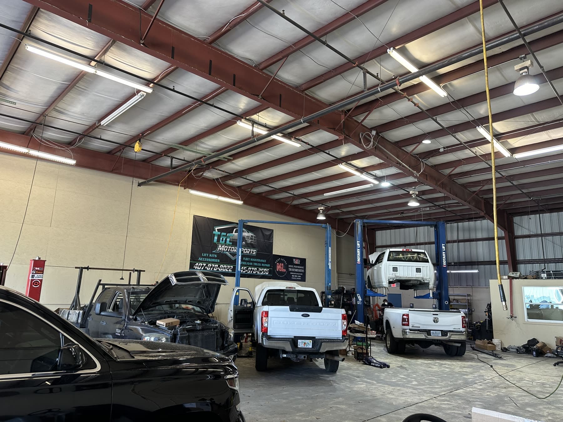 RAM truck on the lift inside the Sunstate Diesel workshop in Orlando
